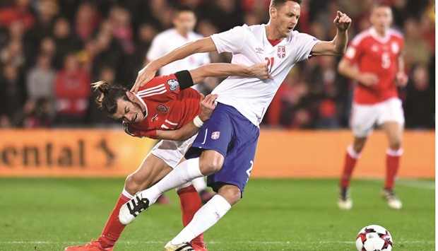 Walesu2019 forward Gareth Bale (L) vies with Serbiau2019s midfielder Nemanja Matic during the World Cup 2018 qualification match between Wales and Serbia at Cardiff City stadium.