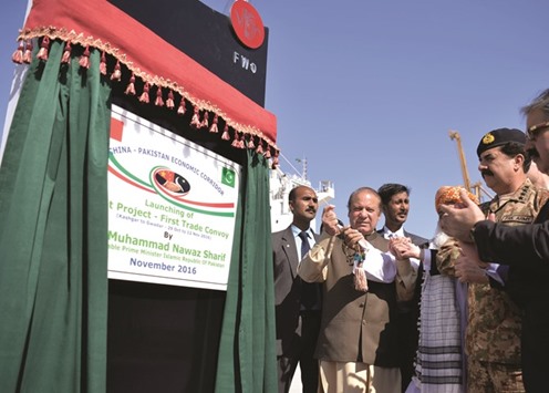 Prime Minister Nawaz Sharif unveiling the plaque of Pilot Project - First Trade Convoy at Gwadar Port yesterday.