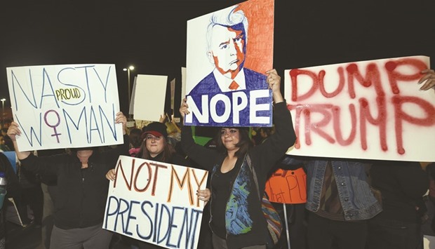 Anti-Donald Trump protesters gather at The Linq Promenade before marching on the Las Vegas Strip.
