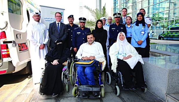 HE Dr. Hanan Mohamed al-Kuwari and other dignitaries with some non-emergency patients at the launch of the new ambulances.