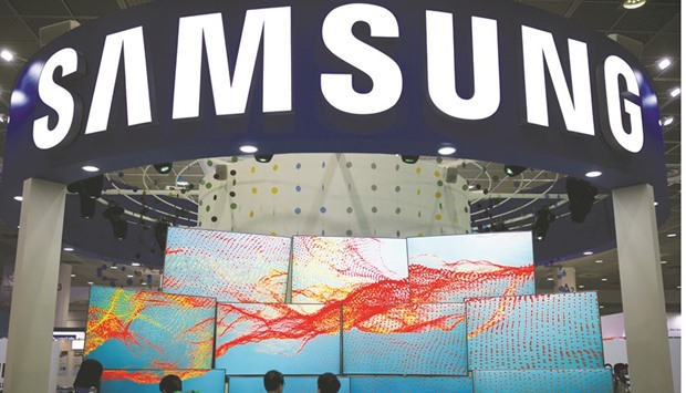 Visitors take a look at Samsung Electronicsu2019 TV sets during Korea Electronics Show 2016 in Seoul. The firm agreed to acquire Harman for $112 per share in cash, a 28% premium to the US firmu2019s closing price on Friday.
