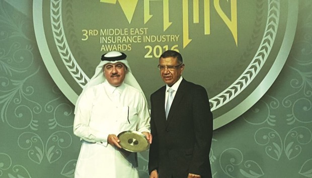 Qatar Islamic Insurance CEO Ali Ibrahim al-Abdulghani receives the award on behalf of chairman of the board Sheikh Abdullah bin Thani al-Thani during the ceremony.