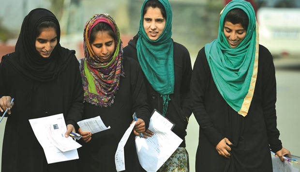 Students leave after sitting secondary school exams at an examination centre in Srinagar yesterday.