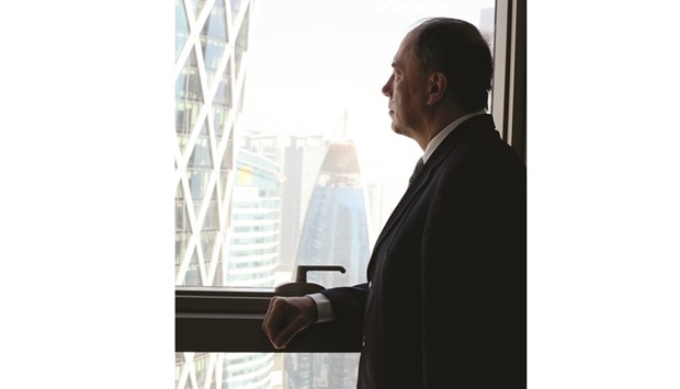 ROOM WITH A VIEW: Ambassador Kempel looks out at the Austrian embassy.     Photo by Anand Holla