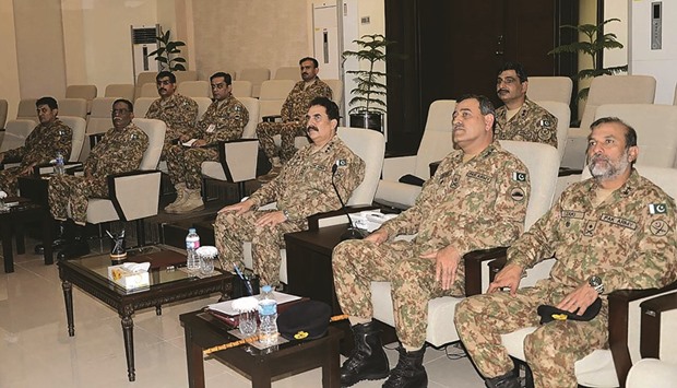 In this handout photograph released by Pakistanu2019s Inter Services Public Relations (ISPR) yesterday, Pakistani army chief Raheel Sharif and military officials listen during a briefing on the situation at the Line of Control (LoC) in disputed Kashmir, in Jhelum some 120km south of Islamabad.