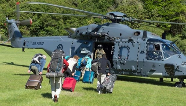 A New Zealand Defence Force helicopter evacuating some of 1,200 of tourists from Kaikoura stranded by a 7.8 earthquake.