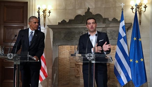 US President Barack Obama and Greek Prime Minister Alexis Tsipras hold a press conference after their meeting at the Maximos Mansion in Athens on Tuesday.