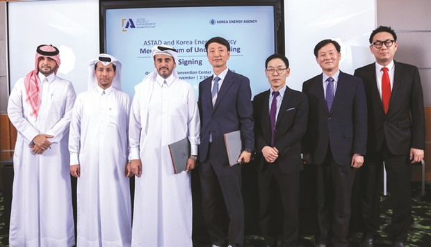 Astad and Korea Energy Agency executives after the agreement signing at the Qatar National Convention Centre .