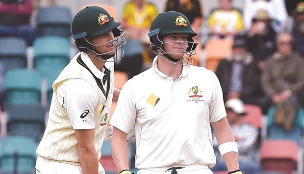 Australiau2019s captain Steven Smith (R) with teammate Adam Voges during the fourth day in the second Test against South Africa.