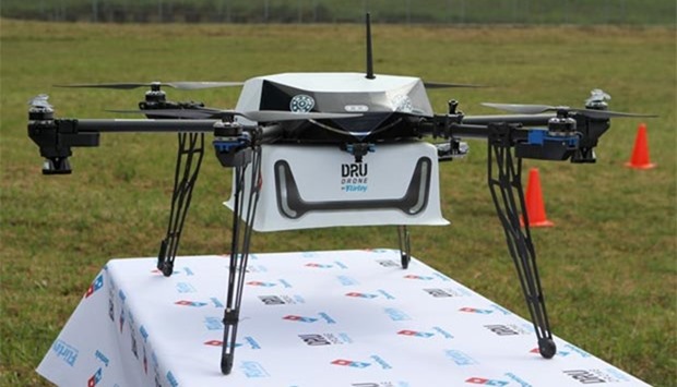 A drone designed to deliver pizzas is seen in Whangaparaoa, New Zealand.