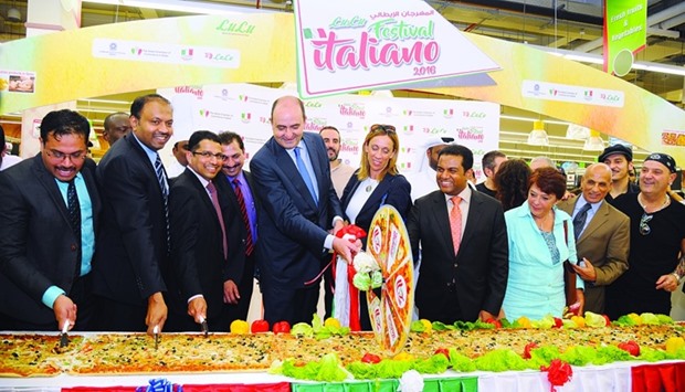 Ambassador Guido De Sanctis, Mohamed Althaf and other officials and dignitaries at the inauguration of u2018Festival Italianou2019 at LuLu Hypermarket, Al Gharafa. A 35m pizza was cut as part of the celebration. PICTURE: Ram Chand