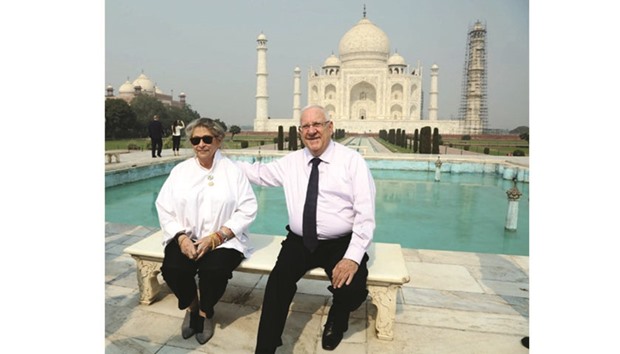 Israeli President Reuven Rivlin and his wife pose for a photo in front of the Taj Mahal.