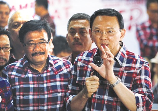 Jakarta Governor Basuki Tjahaja Purnama, nicknamed u201cAhoku201d (right), speaks with the media regarding a blasphemy complaint against him while standing next to deputy governor Djarot Saiful Hidayat in Jakarta yesterday.