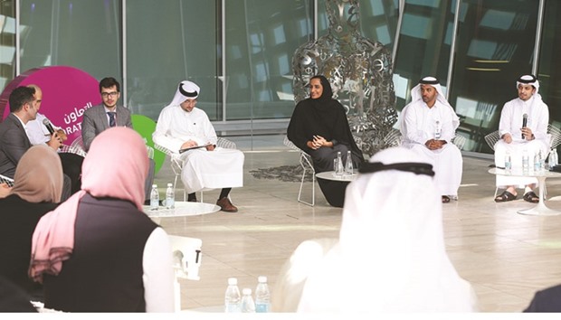 HE Sheikha Hind bint Hamad al-Thani with the Stars of Science finalists and alumni at the QF headquarters yesterday.