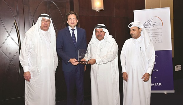 Barazzone being received by Sheikh Faisal, Alfardan and a senior QBA official.