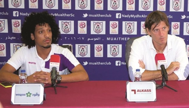 Philip Birrol (right), the head coach of Muaither speaks to the media.