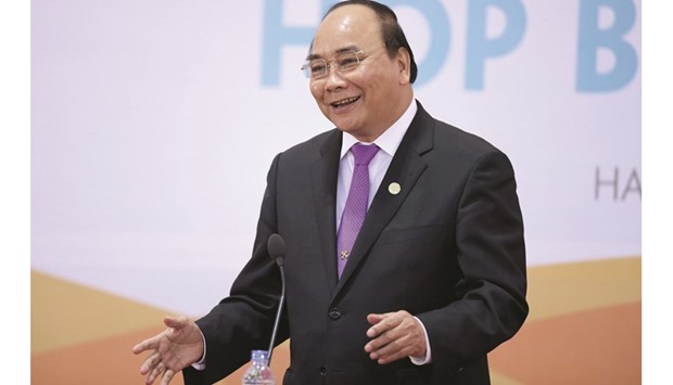 Vietnamu2019s Prime Minister Nguyen Xuan Phuc speaks during a news conference in Hanoi. Vietnam will shelve ratification of a US-led Pacific trade accord due to political changes ahead in the US, but wants to maintain good relations with Washington as much as it does all other countries, Phuc said yesterday.