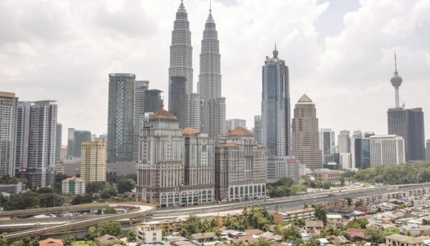 A view of the Petronas Twin Towers (centre) in Kuala Lumpur. Petronas is the majority owner of the Pacific Northwest LNG project, which could produce as much as 19.2mn tonnes a year of the fuel, or about 8% of last yearu2019s global trade.