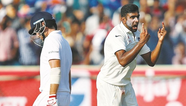 Indiau2019s Ravichandran Ashwin (R) celebrates the dismissal of Englandu2019s Joe Root yesterday during the second Test being played in Visakhapatnam, India.