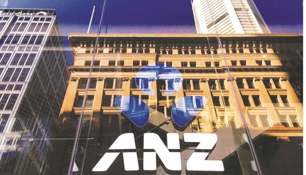 The logo of the ANZ Banking Group is displayed in the window of a newly opened branch in Sydney. The banku2019s Australian insurance and wealth business reported a full-year cash profit of A$327mn for the year ended September 30, down 24% from a year earlier.