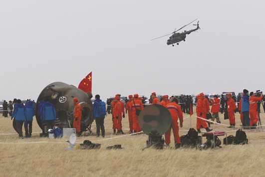 Researchers examine the re-entry capsule of Chinau2019s Shenzhou-11 spacecraft after it landed on earth with two astronauts Jing Haipeng and Chen Dong.