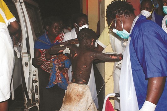 A badly-burnt child arrives at the Provincial Hospital in Tete on Thursday evening, after a truck carrying petrol burst into flames. At least 60 people were killed and hundreds injured when the truck carrying petrol blew up in western Mozambique, the government said in a statement.