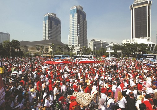 People take part in a rally against what they see as growing racial and religious intolerance in Jakarta.