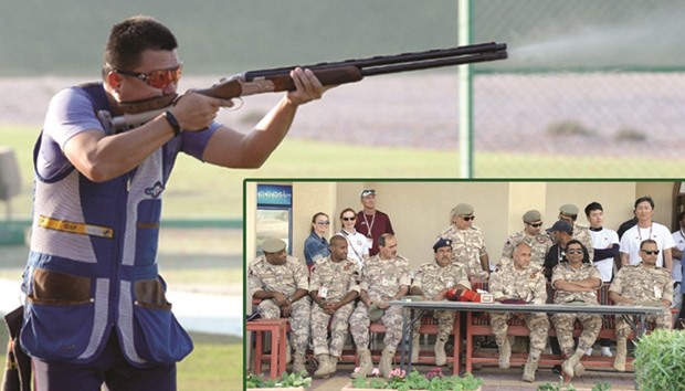 Chinau2019s Xu Ying in action during the skeet event of the 49th CISM World Military Shooting Championship yesterday.  Bottom right: Qatar military officers enjoying the menu2019s skeet final yesterday. PICTURES: Thaju Dheen