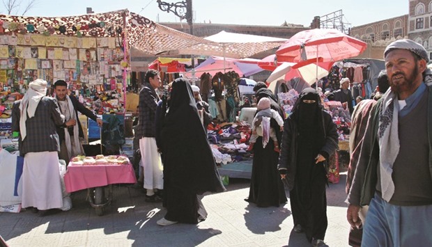 Yemenis shop at a market yesterday in Sanaa as a 48-hour ceasefire began.