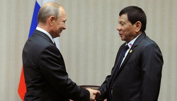 Russian President Vladimir Putin and Philippine President Rodrigo Duterte attend a meeting on the sidelines of the Asia-Pacific Economic Cooperation (Apec) Summit in Lima on Saturday.