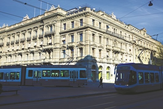 Trams pass the headquarters of Credit Suisse Group in Zurich. The creation of the new subsidiary that caters for Swiss retail, corporate, private and investment banking clients, is part of a broader shake-up of Credit Suisse under CEO Tidjane Thiam to focus more on wealth management and less on volatile investment banking.