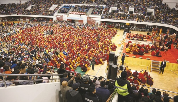The Dalai Lama (right) addressing those gathered at Buyant Ukhaa sport palace in Ulan Bator yesterday.