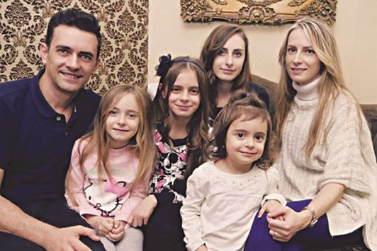 Emily Cozmiuc, front, with parents Ciprian and Larisa and sisters including Celeste, centre.