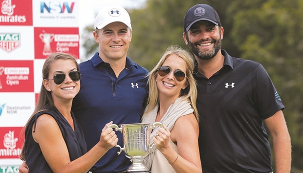 Jordan Spieth poses with his trophy alongside his girlfriend Annie Verret (left), his caddie Michael Greller (right) and Grelleru2019s wife Ellie. (Reuters)