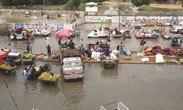 A flooded market is seen after heavy rain in southern Pakistani port city of Karachi.