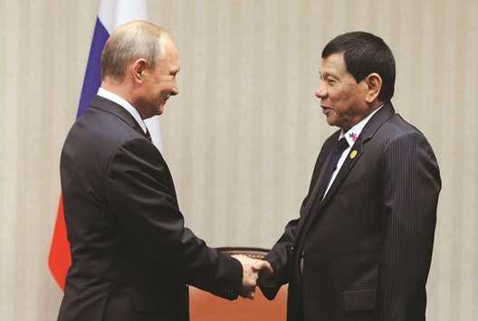 Russian President Vladimir Putin and Philippine President Rodrigo Duterte attend a meeting on the sidelines of the Asia-Pacific Economic Co-operation (Apec) Summit in Lima, Peru.
