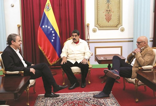 Venezuelau2019s President Nicolas Maduro (centre) meets with former Spanish prime minister Jose Luis Rodriguez Zapatero (left) at Miraflores Palace, in Caracas, Venezuela.