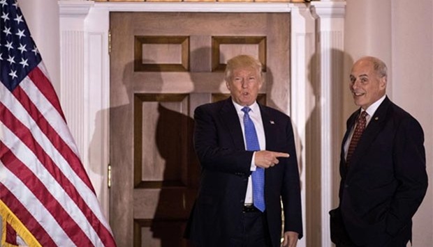 President-elect Donald Trump points at US Marine Corps General John Kelly before their meeting at Trump International Golf Club in Bedminster Township, New Jersey, on Sunday.
