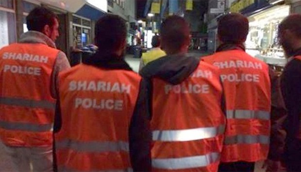 The court ruled that the seven accused members of the group did not breach a ban on political uniforms when they approached people while wearing orange vests bearing the words ,Sharia Police,.