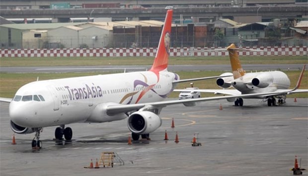 A TransAsia Airways passenger plane is seen at Songshan Airport, after its board approved a move to wind down the company and that all flights would be suspended, in Taipei on Tuesday.