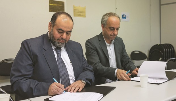 QCu2019s Yousuf bin Ahmed al-Kuwari (left) and MSF-Franceu2019s Dr Mu00e9guerditch Tarazian sign the MoU at MSFu2019s headquarters in Paris.