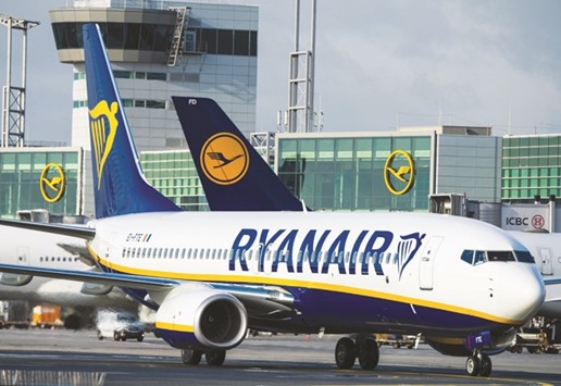 A Ryanair plane stands in front of a Lufthansa aircraft in Frankfurt am Main, western Germany. Ryanair said it will start flying from Frankfurt airport from next summer to four tourist destinations in Spain and Portugal, sparking outrage among German competitors.