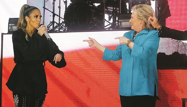 US Democratic presidential nominee Hillary Clinton joining performer Jennifer Lopez at a campaign concert in Miami, Florida, recently.