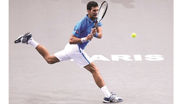Serbiau2019s Novak Djokovic returns the ball to Luxembourgu2019s Gilles Muller during their second round match at the ATP World Tour Masters 1000 indoor tournament in Paris yesterday. (AFP)