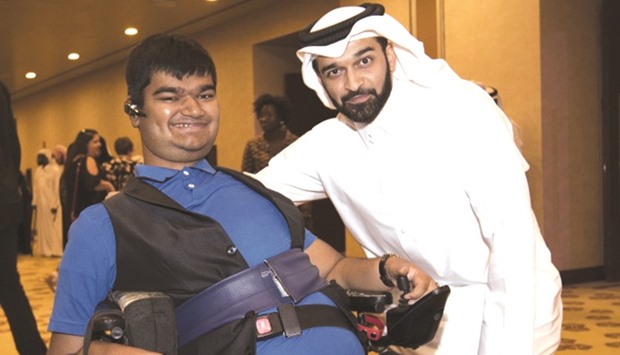 Al-Thawadi with a member of the Accessibility Forum at the meeting yesterday.