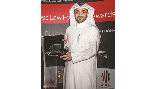 Al-Taweel with the award.