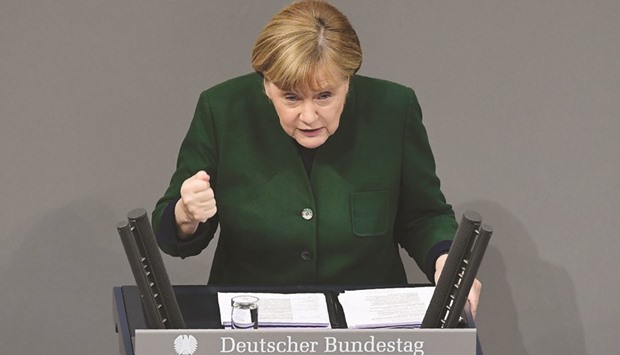 German Chancellor Angela Merkel addresses the Bundestag in Berlin yesterday.