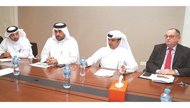 Ashghalu2019s Khalid al-Khayarin (second right) and Khalid al-Obaidaly (second from left) at a meeting at the Doha North Sewage Treatment Plant, Umm Slal Ali, yesterday: PICTURES: Jayan Orma