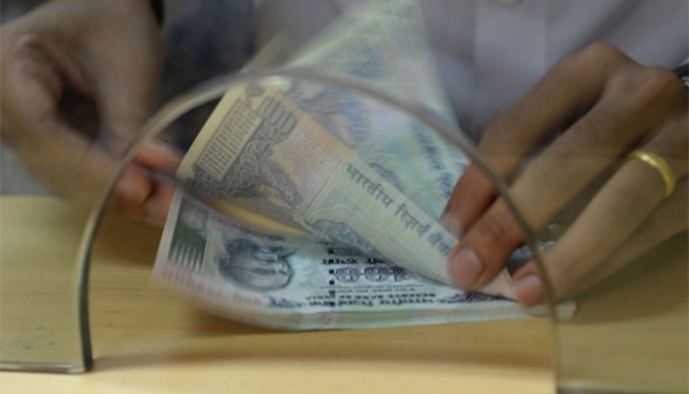 The rupee fell to a record low of 69.0950 per dollar on Thursday. 