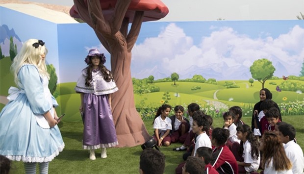 Alice in Wonderland characters welcome young visitors, who were joined by HE Sheikha Hind bint Hamad al-Thani, at the Characters' Village.
